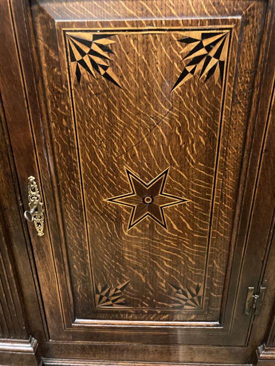 A late 18th century inlaid oak hanging corner cupboard, width 77cm depth 43cm height 108cm